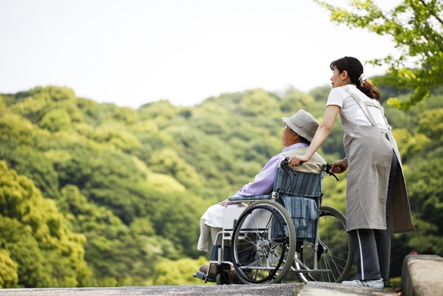Caregiver helping elderly